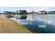 A tranquil lake scene with lush green shoreline creates a serene and picturesque setting at 552 Marsh Cv Cir, Summerville, SC 29486
