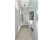 Walk-in shower with sleek grey tile, built-in bench, and dual shower heads at 552 Marsh Cv Cir, Summerville, SC 29486