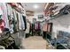 Spacious walk-in closet with ample storage, shelving and hanging clothes racks at 552 Marsh Cv Cir, Summerville, SC 29486