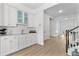 Elegant wet bar featuring a sink, cabinetry, and direct access to the hallway at 552 Marsh Cv Cir, Summerville, SC 29486