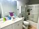 Bathroom with a white vanity, mirror, toilet and a shower/tub combination with glass doors at 565 Mountain Laurel Cir, Goose Creek, SC 29445