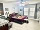 Bedroom with a queen bed, side tables, ceiling fan, pictures and decor on the wall at 565 Mountain Laurel Cir, Goose Creek, SC 29445
