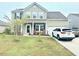 Charming two-story home with well-maintained landscaping and a two-car garage at 565 Mountain Laurel Cir, Goose Creek, SC 29445