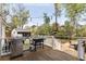 Inviting back deck with grill and string lights, perfect for outdoor entertaining and relaxation at 639 Bridlewood Ln, Mount Pleasant, SC 29464