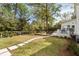 Spacious backyard features a deck, swimming pool, and lush green lawn, perfect for outdoor entertaining at 639 Bridlewood Ln, Mount Pleasant, SC 29464