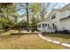 Inviting backyard with a deck, swimming pool, and manicured lawn, ideal for relaxation and gatherings at 639 Bridlewood Ln, Mount Pleasant, SC 29464