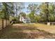 Lush backyard with a swimming pool, manicured lawn, and fencing, perfect for outdoor activities and enjoyment at 639 Bridlewood Ln, Mount Pleasant, SC 29464