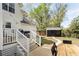 Backyard view showcasing deck stairs, a modern shed, and a grill, creating an outdoor living space at 639 Bridlewood Ln, Mount Pleasant, SC 29464