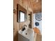 Stylish bathroom featuring wood paneling, a modern sink, and a unique patterned shower curtain at 639 Bridlewood Ln, Mount Pleasant, SC 29464