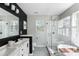 Elegant bathroom featuring double vanity, large mirror, glass enclosed shower, and soaking tub at 639 Bridlewood Ln, Mount Pleasant, SC 29464