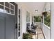 Inviting front porch featuring comfortable seating, decorative plants, and a view of the outdoors at 639 Bridlewood Ln, Mount Pleasant, SC 29464