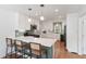Stylish kitchen boasting white cabinetry, an island with barstool seating, and updated appliances at 639 Bridlewood Ln, Mount Pleasant, SC 29464