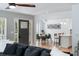 Open concept living room with hardwood floors, modern furniture, and a seamless flow to the dining area at 639 Bridlewood Ln, Mount Pleasant, SC 29464