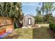 Backyard shed featuring a modern exterior, outdoor shower, and stylish landscaping, perfect for guests at 639 Bridlewood Ln, Mount Pleasant, SC 29464