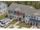 Townhome exterior shows well-maintained landscaping, a covered entryway, and convenient parking out front at 7787 Montview Rd, North Charleston, SC 29418
