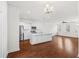 Spacious living room features an open floor plan with hardwood floors connecting to the kitchen at 7787 Montview Rd, North Charleston, SC 29418