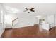 Spacious living room with hardwood floors flowing into a modern kitchen at 7787 Montview Rd, North Charleston, SC 29418