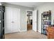 View of bedroom with double closets and doorway to another room, offering space and convenience at 7818 Expedition Dr, North Charleston, SC 29420