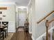 Inviting hallway view with hardwood floors and staircase access at 7818 Expedition Dr, North Charleston, SC 29420