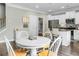 Bright kitchen features stainless appliances, a center island, and a dining area at 7818 Expedition Dr, North Charleston, SC 29420