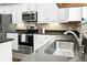 Bright kitchen features stainless appliances and countertop with backsplash at 7818 Expedition Dr, North Charleston, SC 29420