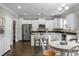 Bright kitchen features stainless appliances, a center island with seating, and a dining area at 7818 Expedition Dr, North Charleston, SC 29420