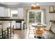 Bright kitchen features stainless appliances and a dining area with backyard access at 7818 Expedition Dr, North Charleston, SC 29420