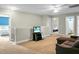 A spacious living room with a comfortable sofa and a television set to provide entertainment at 7818 Expedition Dr, North Charleston, SC 29420
