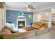 Comfortable living room with a fireplace and dining room beyond at 7818 Expedition Dr, North Charleston, SC 29420
