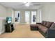The spacious living room is perfect for relaxing or entertaining with comfortable sofa and TV at 7818 Expedition Dr, North Charleston, SC 29420