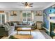 Spacious living room with large sectional sofa and natural light at 7818 Expedition Dr, North Charleston, SC 29420
