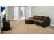 This living room includes neutral walls, a couch, and wall mounted television at 7818 Expedition Dr, North Charleston, SC 29420