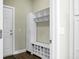 This mudroom features a door, cabinet, and storage bench at 7818 Expedition Dr, North Charleston, SC 29420