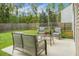 The backyard patio features comfortable seating, perfect for outdoor relaxation and entertaining at 7818 Expedition Dr, North Charleston, SC 29420