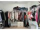 This walk-in closet includes hanging racks with a variety of clothing at 7818 Expedition Dr, North Charleston, SC 29420