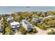 Expansive neighborhood aerial showcasing diverse houses, a rooftop deck, and proximity to the coast at 904 Middle St, Sullivans Island, SC 29482
