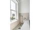 Small bathroom featuring a zero entry shower and patterned tile wall and flooring at 904 Middle St, Sullivans Island, SC 29482