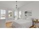 Bright bedroom with a white color scheme, a large bed, and multiple windows allowing natural light at 904 Middle St, Sullivans Island, SC 29482