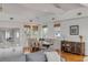Open-concept design boasts dining space, kitchen, and hardwood floors at 904 Middle St, Sullivans Island, SC 29482
