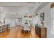 Bright dining room boasts hardwood floors, a large dining table, and multiple windows at 904 Middle St, Sullivans Island, SC 29482