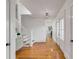 Bright foyer with hardwood flooring, staircase, stylish furniture, and leading to other rooms at 904 Middle St, Sullivans Island, SC 29482