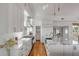 Bright, modern kitchen with white cabinetry, marble countertops, and high-end stainless-steel appliances at 904 Middle St, Sullivans Island, SC 29482