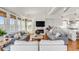 Spacious living area with hardwood floors, a marble fireplace, and comfortable seating at 904 Middle St, Sullivans Island, SC 29482