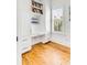 Bright office with built-in shelving, drawers, and desk provides a functional workspace at 904 Middle St, Sullivans Island, SC 29482