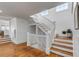 Bright staircase features wood treads, white risers, and an abundance of natural light from overhead skylights at 904 Middle St, Sullivans Island, SC 29482