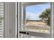 View of a beach and fire hydrant through a screen door at 904 Middle St, Sullivans Island, SC 29482