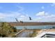 Picturesque marsh view featuring pelicans in flight over the serene waterfront at 904 Middle St, Sullivans Island, SC 29482