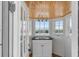 Wet bar featuring beadboard walls, white countertop, and a view of the water at 904 Middle St, Sullivans Island, SC 29482