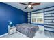 Bright bedroom featuring a stylish ceiling fan, built-in shelves, and a cozy window seat at 9723 Flooded Field Dr, Ladson, SC 29456