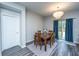 Cozy dining area with stylish chandelier and direct access to the backyard through sliding glass doors at 9723 Flooded Field Dr, Ladson, SC 29456